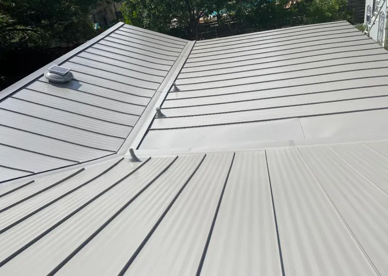 Solar attic fan installed on a metal roof for Roof Ventilation in Rocky River